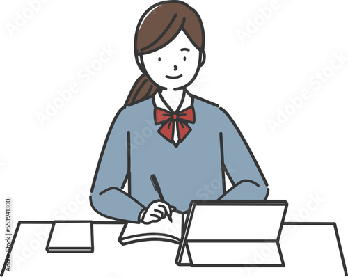 タブレットを使って勉強する女子学生