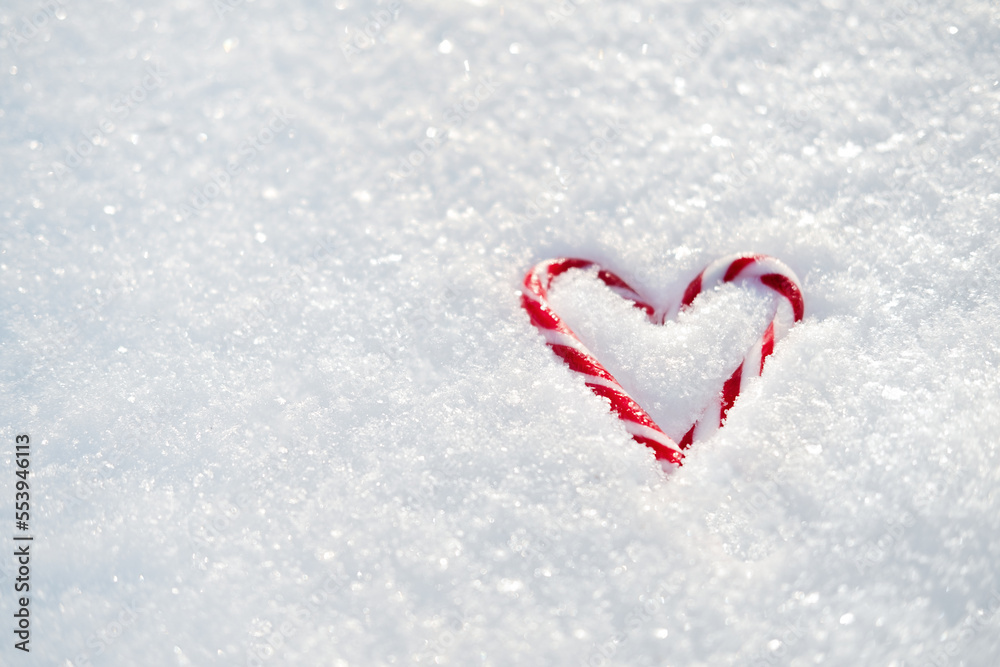 Valentines day, love, romantic web banner with red candy heart on white snow. Valentines day background outdoors. Copy space.