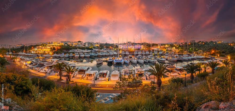 Landscape with panoramic night scene of Cala D`or port in Palma Mallorca Island, Spain