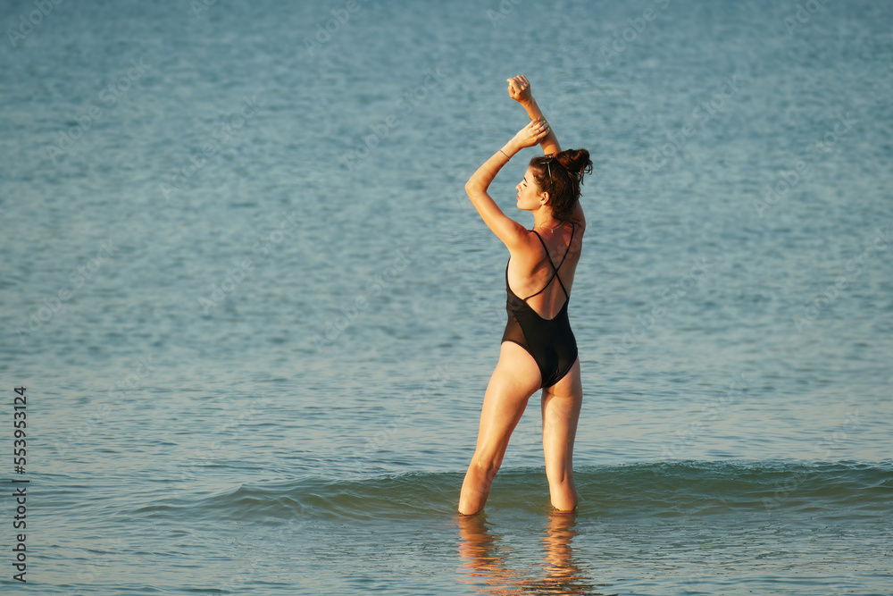 Brunette girl resting on the beach. Brunette girl resting on the beach.