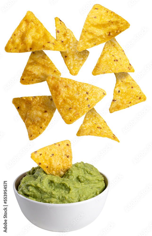 Nachos falling on a bowl with guacamole Nachos falling on a bowl with guacamole