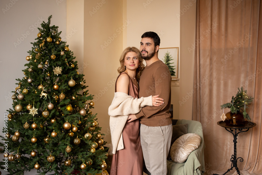 Romantic couple relaxing at home on Christmas time, christmas concept