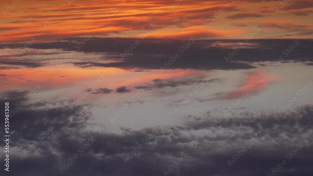Colorful Dawn Sky Sun Cirrus Clouds Time Lapse. Aerial Drone Shooting, Beautiful Summer Sunrise. Orange Pink Gray Blue Sky at Dawn with Light Clouds, Beautiful Background. Colorful Dawn Sky Sun Cirrus Clouds Time Lapse. Aerial Drone Shooting, Beautiful Summer Sunrise. Orange Pink Gray Blue Sky at Dawn with Light Clouds, Beautiful Background.