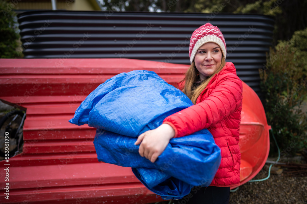 sleeping under a tarp. hiking and camping with a blue tarp sleeping under a tarp. hiking and camping with a blue tarp