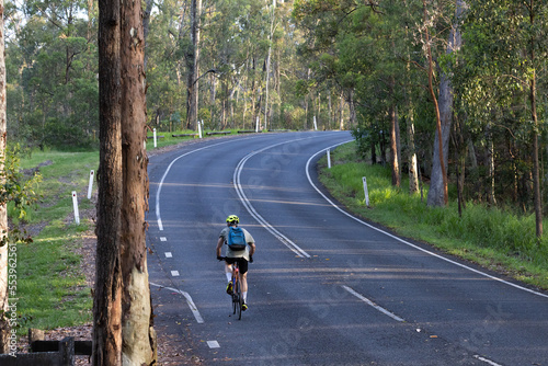 person riding bicycle on the road