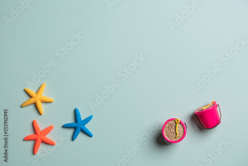 Model sand and starfish on green background