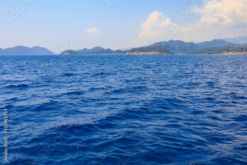 View of the rocky shore from the sea. Mediterranean Sea in Turkey. Popular tourist places. Background