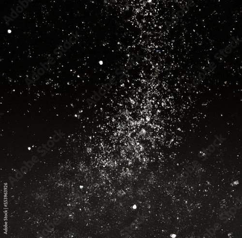 Image of close up of multiple grey particles on dark background created using Generative AI technology