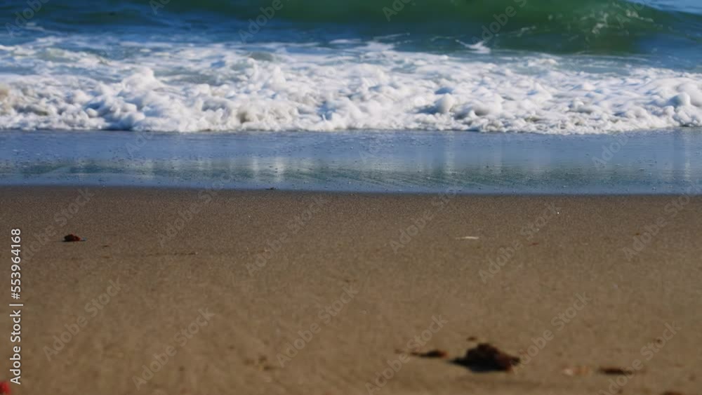 Calm ocean waves crashing on the shore