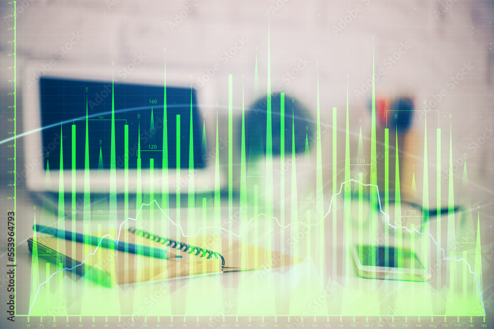 Forex Chart hologram on table with computer background. Double exposure. Concept of financial markets. Forex Chart hologram on table with computer background. Double exposure. Concept of financial markets.