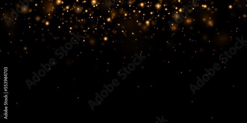 Gold sparks and golden stars glitter special light effect. Vector sparkles on transparent background. Christmas abstract.