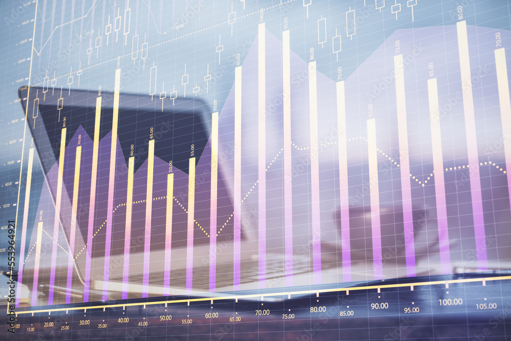 Forex Chart hologram on table with computer background. Double exposure. Concept of financial markets. Forex Chart hologram on table with computer background. Double exposure. Concept of financial markets.