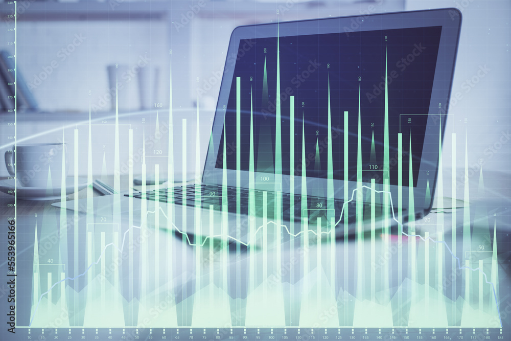 Forex Chart hologram on table with computer background. Double exposure. Concept of financial markets. Forex Chart hologram on table with computer background. Double exposure. Concept of financial markets.