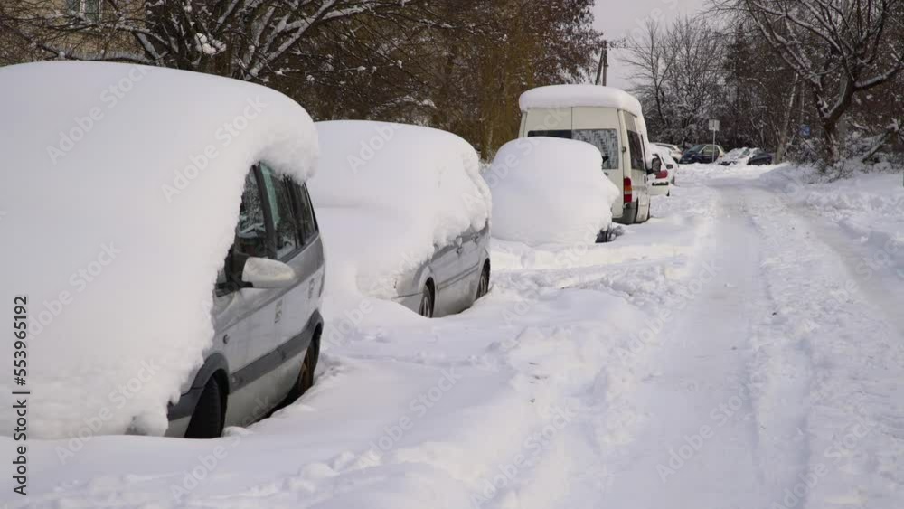 Car under thick blanket of snow after storm. Vehicles buried under ice. Nobody Car under thick blanket of snow after storm. Vehicles buried under ice. Nobody