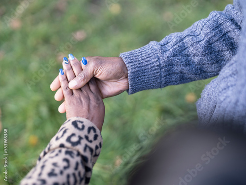 Close-up of senior couple holding hands