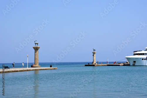monument of deers on the waterfront of Rhodes island with blue sky and sea on horizon