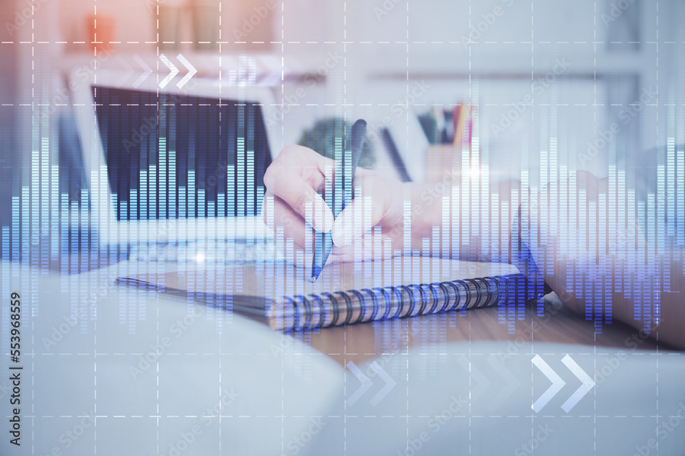 Financial graph displayed on woman's hand taking notes background. Concept of research. Double exposure Financial graph displayed on woman's hand taking notes background. Concept of research. Double exposure