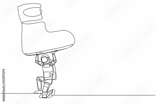 Continuous one line drawing young astronaut under giant feet stomping. Violence of dictator toward tiny spaceman, big shoes crush science. Cosmonaut outer space. Single line design vector illustration