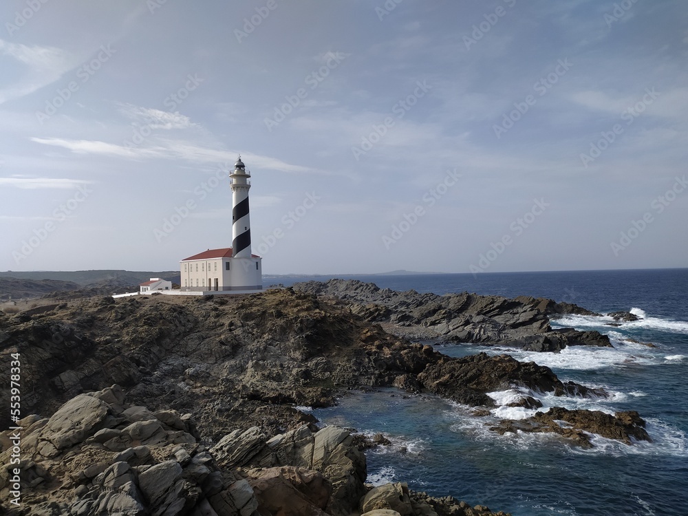 lighthouse on the edge of a cliff protecting the ships of the Mediterranean