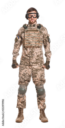 Soldier in Ukrainian military uniform, tactical goggles and headphones on white background