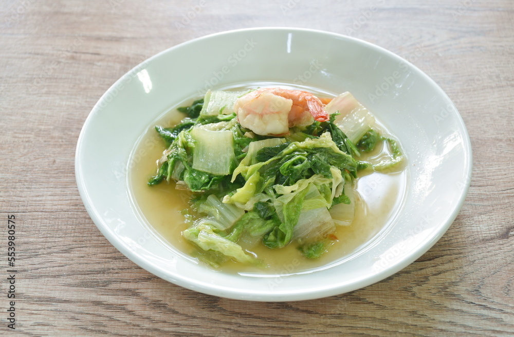 stir fried slice green Chinese cabbage and carrot with shrimp on plate stir fried slice green Chinese cabbage and carrot with shrimp on plate