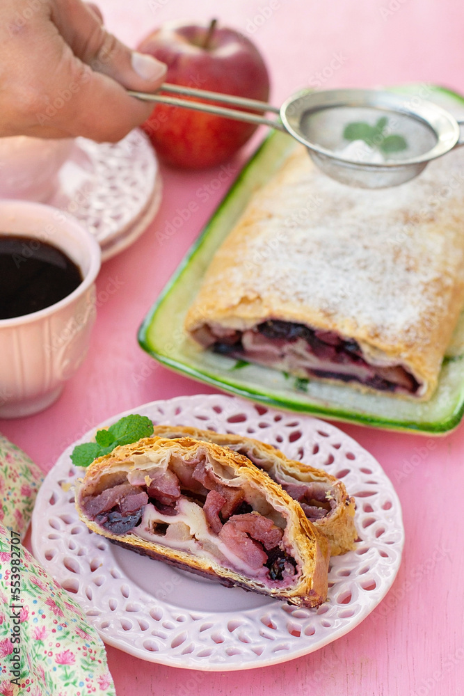 Traditional Austrian apple strudel with cherries and cinnamon