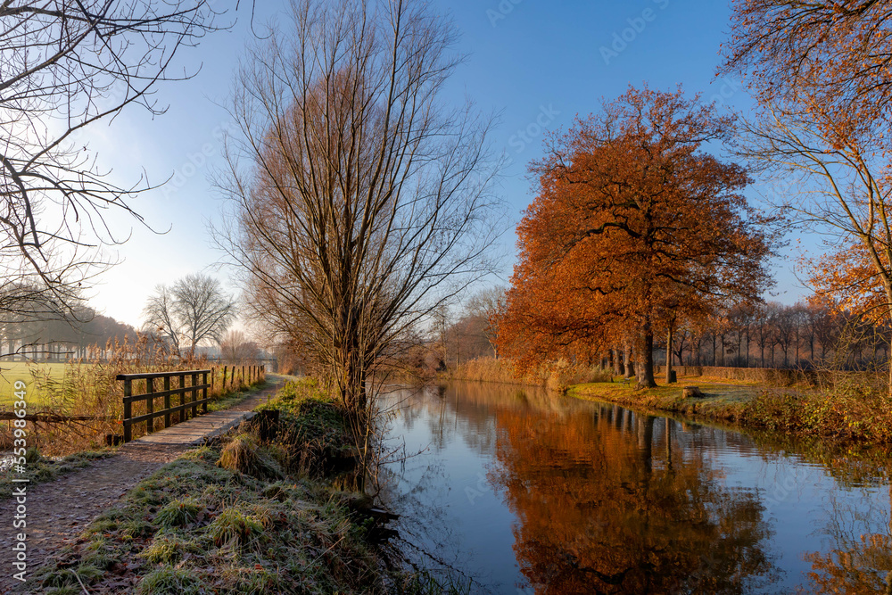 Winter landscape view of white frost in morning, Nature path along the Kromme Rijn river (Crooked Rhine) in Rhijnauwen, Bunnik is a municipality and a village in the province of Utrecht Netherlands.
