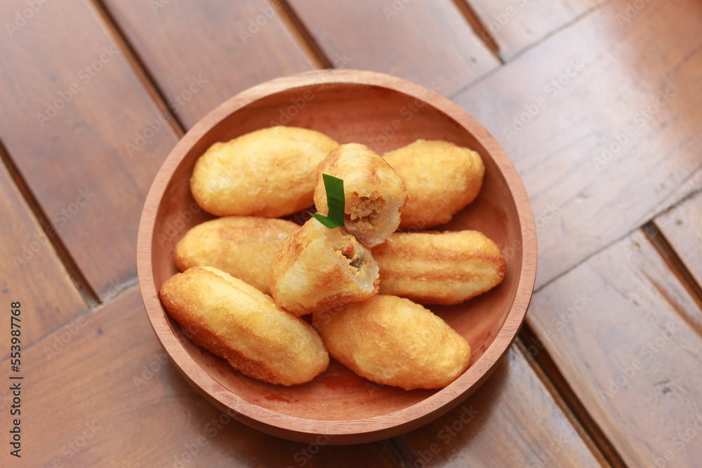 Comro or combro, a traditional Javanese snack made of deep fried grated cassava filled with a savory mix of oncom or fermented soy bean cake and chili Comro or combro, a traditional Javanese snack made of deep fried grated cassava filled with a savory mix of oncom or fermented soy bean cake and chili
