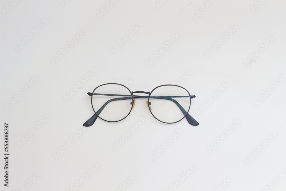 a close up of eyeglasses with black frames isolated on white background a close up of eyeglasses with black frames isolated on white background