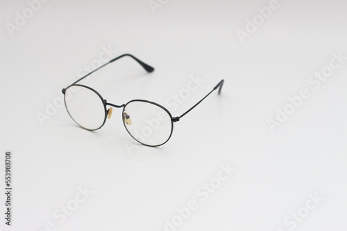 a close up of eyeglasses with black frames isolated on white background