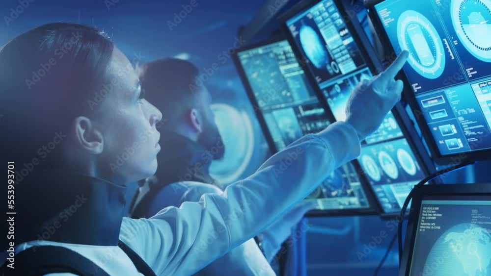 Team of astronauts in a space suits aboard the orbital station. A crew of cosmonauts piloting the spaceship. Man and woman in space. Galactic travel and science concept. Team of astronauts in a space suits aboard the orbital station. A crew of cosmonauts piloting the spaceship. Man and woman in space. Galactic travel and science concept.