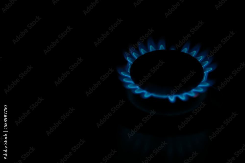 Natural gas burning a blue flames on black background. Natural gas burning a blue flames on black background.