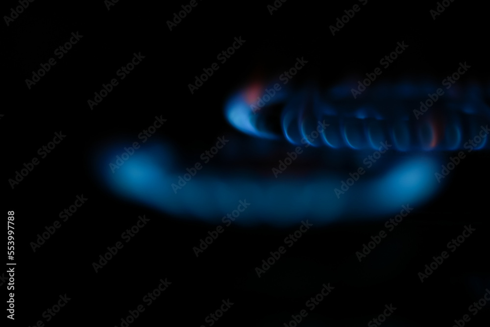 Natural gas burning a blue flames on black background. Natural gas burning a blue flames on black background.