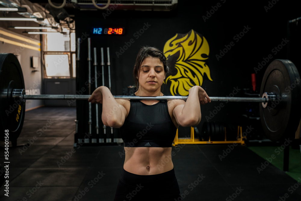 Fit woman holding a barbell