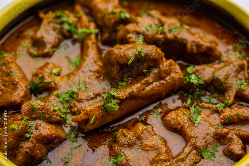 Indian style Mutton OR Gosht Masala OR indian lamb meat rogan josh served with Naan © StockImageFactory
