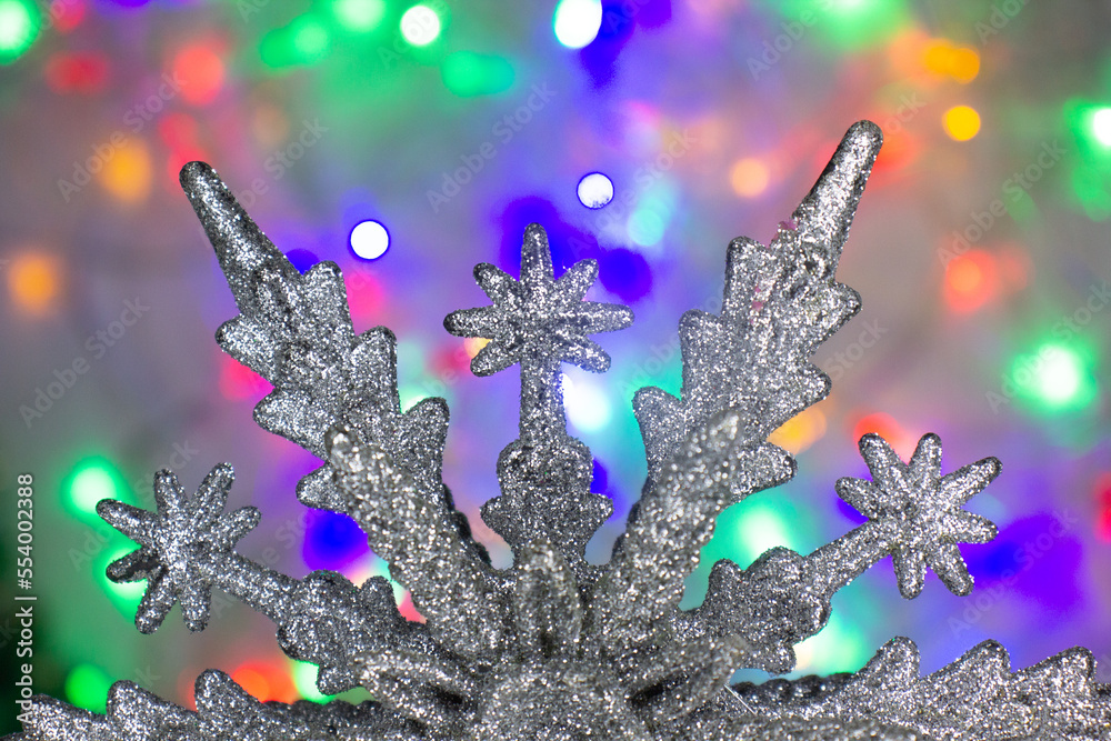 white star decoration on bokeh background christmas lights blue green red white star decoration on bokeh background christmas lights blue green red
