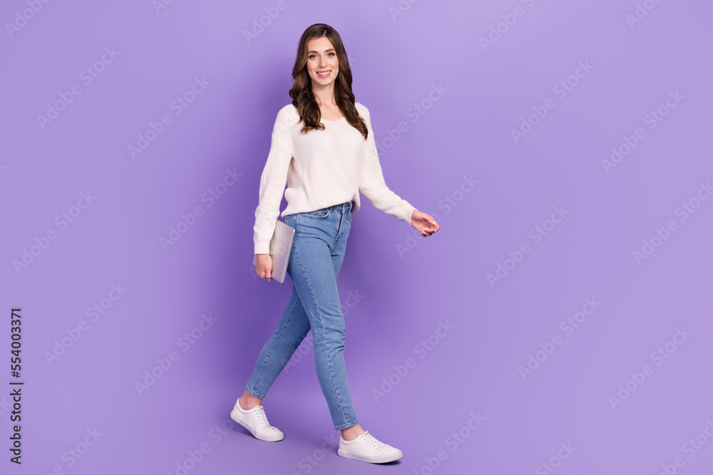 Full length photo of cheerful stylish lady move walk empty space dream choose buy quality new device isolated on purple color background Full length photo of cheerful stylish lady move walk empty space dream choose buy quality new device isolated on purple color background