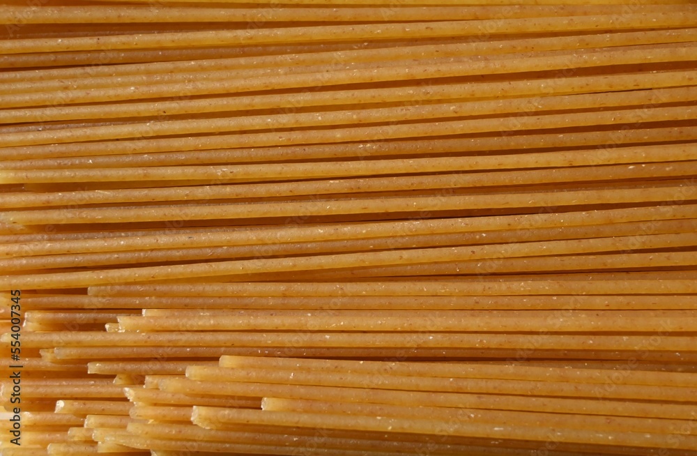 Fondo con detalle y textura de multitud de espaguetti en tonos marrones Fondo con detalle y textura de multitud de espaguetti en tonos marrones