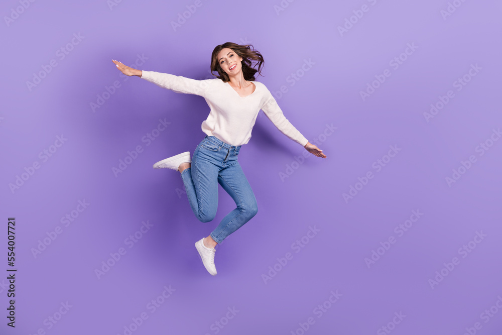 Full length photo of crazy childish good mood lady rejoice win ticket trip abroad empty space isolated on purple color background