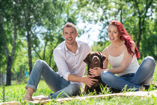 Couple with a dog in the park