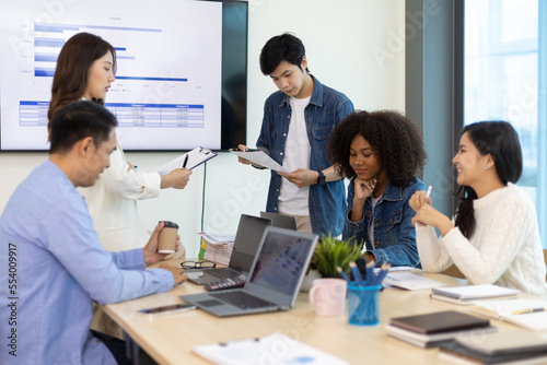 Young people meeting to discuss successful business projects in the office. Human relations and working with colleagues in the organization happily.