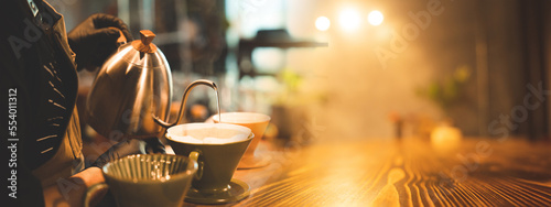 A man is pouring coffee int...