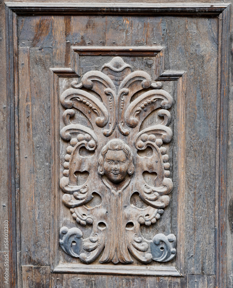 Detail of the wooden door of a church in Romania