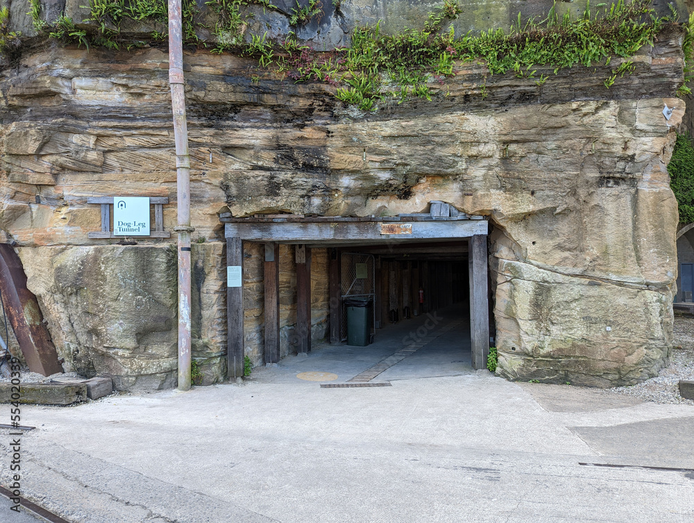 Dog leg tunnel carved out of the sandstone rock to allow easy access between two parts of the