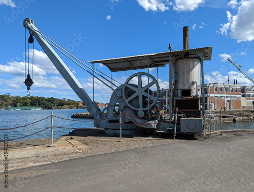 An old steam powered crane sitting on the edge of the dock at Cockatoo Island, Sydney, Australia.
