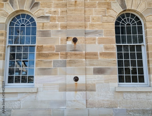 Photography Beautiful arched colonial windows set in a sandstone wall on Cockatoo Island, Sy