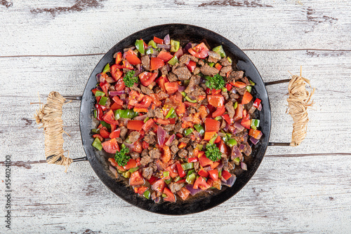 Turkish Food Et Kavurma. Meat Saute Turkish Et sote on black ground. Turkish name : Sac Tava, Sac Kavurma.
