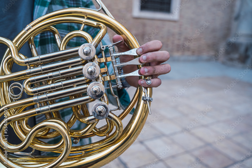 Man playing the horn in the street