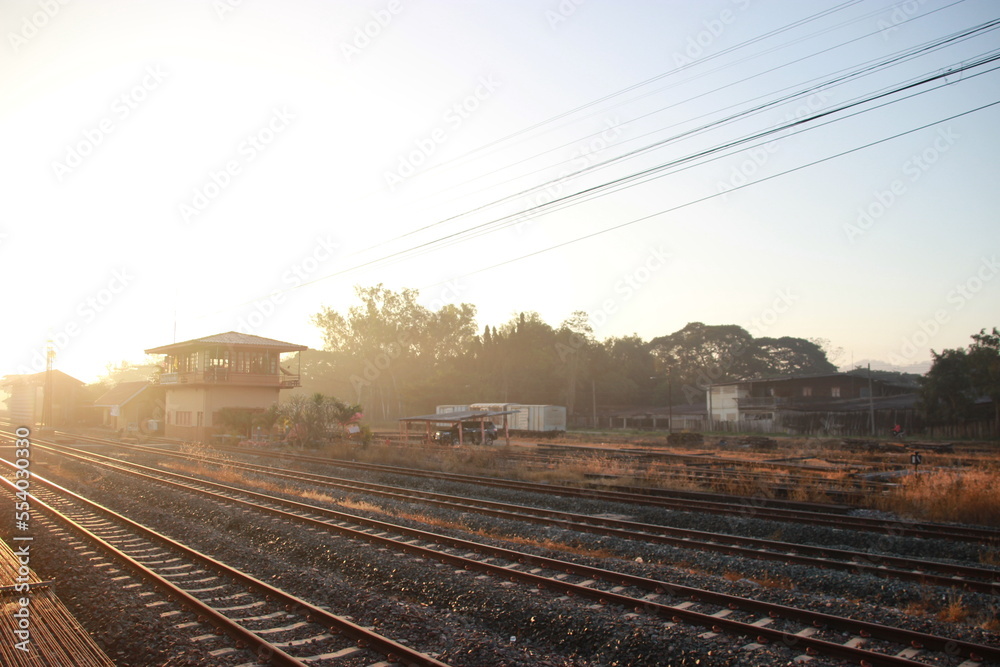 outside window railroad tracks in the countryside with sunset sky view outside window railroad tracks in the countryside with sunset sky view