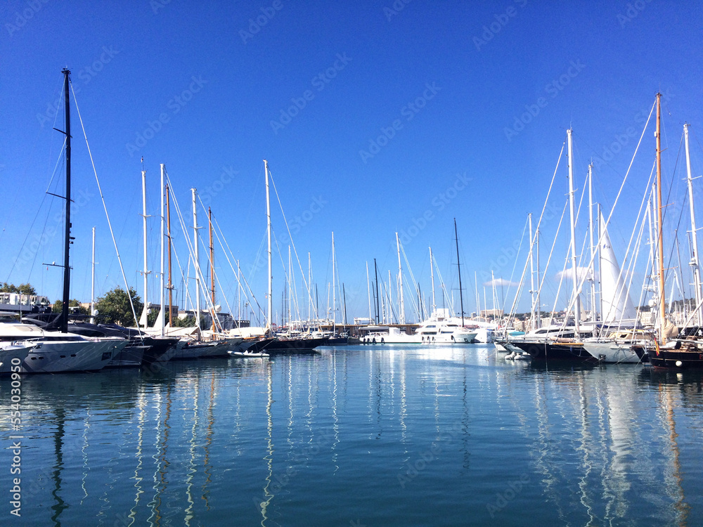 Yachts in marina. Boats in the harbor. Yachts in marina. Boats in the harbor.